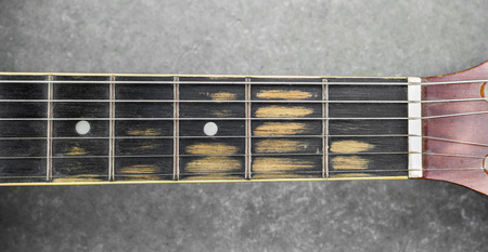 Old Fingerboard of guitar from heavy useの写真素材