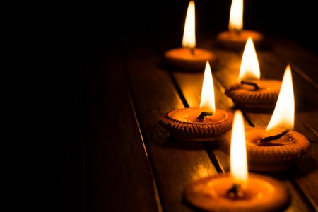 candle light on wood plateの写真素材