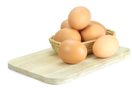 egg fresh on weave basket in white isolate backgroundの写真素材