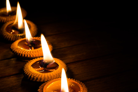 candle light on wood plateの写真素材