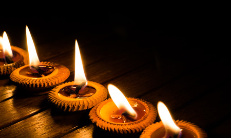 candle light on wood plateの写真素材