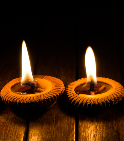 candle light on wood plateの写真素材