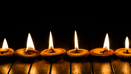 candle light on wood plateの写真素材