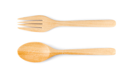 Wooden spoon and fork on white isolate in top viewの写真素材
