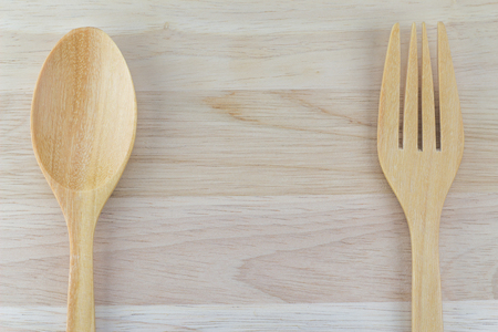 Wooden spoon and fork on table in top viewの写真素材