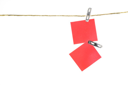 Notes paper cards in clothes pegs on rope with isolate backgroundの写真素材