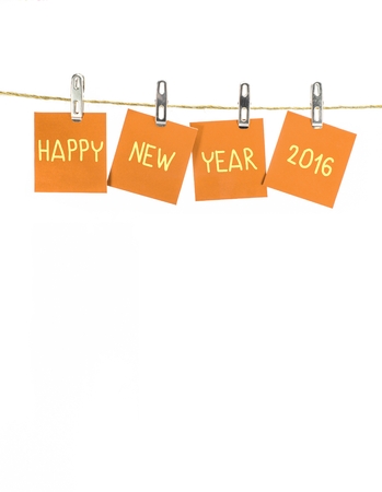 new year 2016 word hanging on the Notes paper cards in clothes pegs on rope with isolateの写真素材