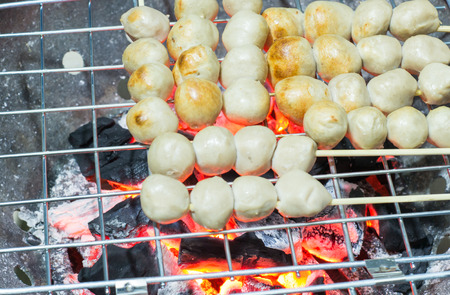 Meatball skewers grilled on the stoveの写真素材
