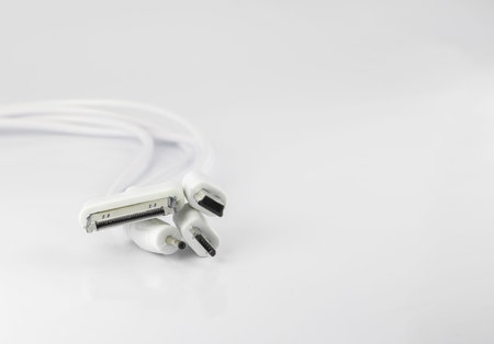 White wire usb mobile charging cable in white background.