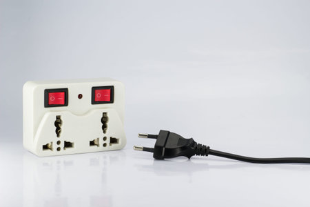 plug socket with switch on/off and plugs on white background