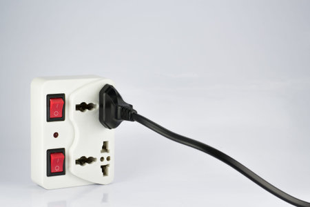 plug socket with switch on/off and plugs on white background
