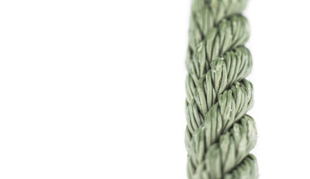 Patterns of nylon rope. texture of green nylon rope on white isolste background for fill text in space. select focus.の写真素材