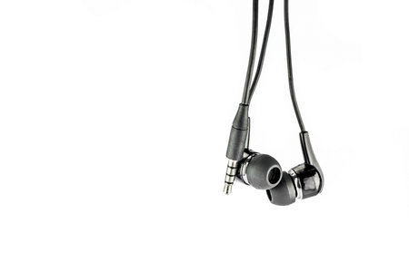 Earphone and 3.5mm jack in isolate background.