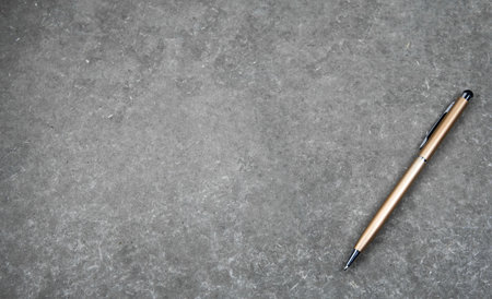 Pen classic style for sign handwriting and nib pen for touch screen tablet on gray vintage backgroundの写真素材