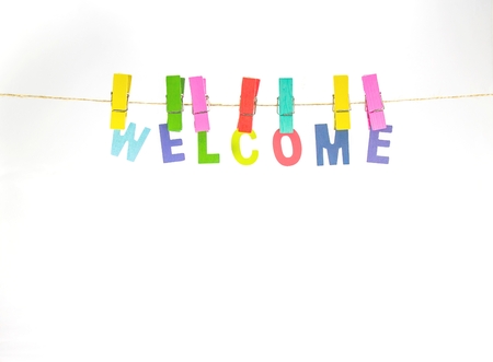 Welcome colorful word fasten clothespins on rope on white space and background.の写真素材