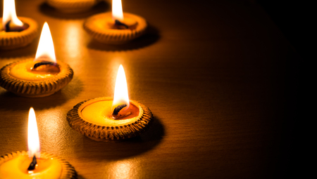 candle light on wood plateの写真素材