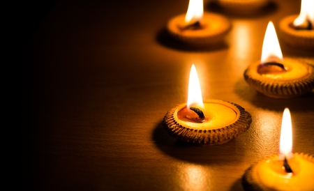 candle light on wood plateの写真素材