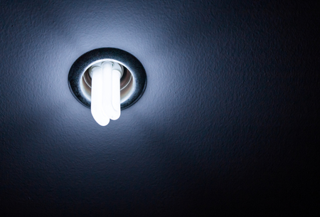 Light of Fluorescent  Bulb on blue dark tone background.の写真素材