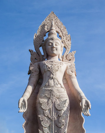 Statue of angel in Thailand on blue sky background.