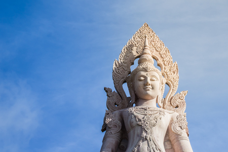 Statue of angel in Thailand on blue sky background.の写真素材