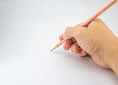 Hand holding pencil, for writing or drawing on white background.の写真素材