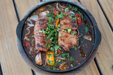 Top view of Thai Spicy grilled pork on hot plateの写真素材