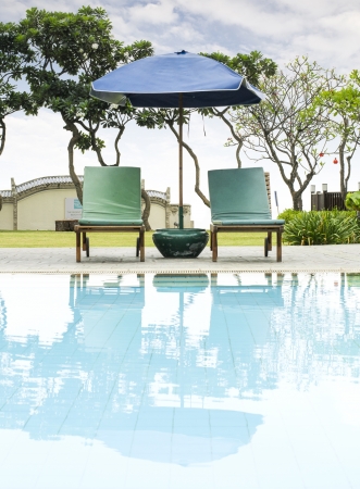 resort beach chairs at Swimming poolの写真素材