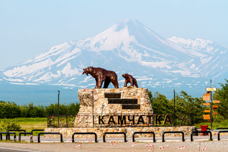 Yelizovo, Russia - July 17, 2018: Monument "She bear with the cub" on the background of the Avachinsky Volcano. Caption: "Here begins Russia."のeditorial素材