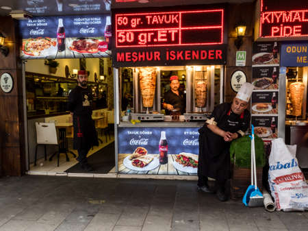 Antalya, Turkey - February 22, 2019: Vendor and cooks waiting of buyers in the fast food kiosk when cooked doner kebab. Street food is very popular in Antalya.のeditorial素材