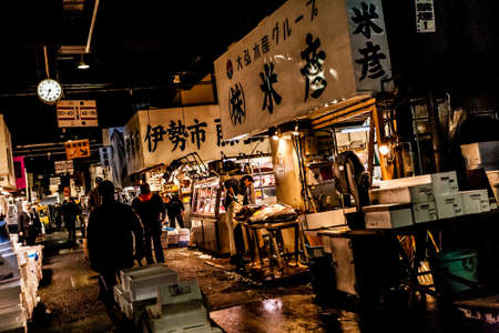 Tokyo, Japan - January 15, 2010: Early morning at Fish Market. Vendor cutting tuna at Tsukiji Fish Market.のeditorial素材