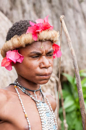 Wamena, Indonesia - January 9, 2010: Man of the Dani tribe in a traditional dress, Dugum Dani Village, Baliem Valley Papua, Irian Jaya, Indonesian New Guineaのeditorial素材