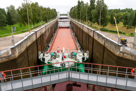 Vytegra, Russia - August 16, 2015: Cargo ship entered the White Sea-Baltic Canal Gateway. It...