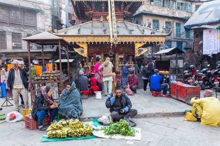 Kathmandu, Nepal - November 17, 2018: Sellers sells fruits and vegetables at the street market in Kathmanduのeditorial素材