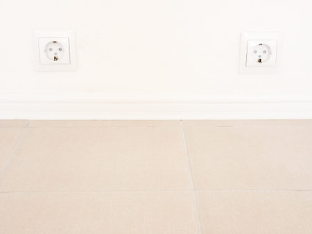 Modern two white socket on the wall. Household electrical equipment.