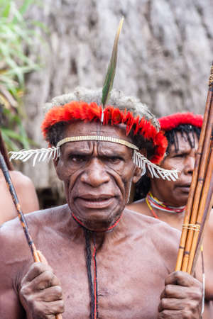 Wamena, Indonesia - January 9, 2010: Man of the Dani tribe in a traditional dress, Dugum Dani Village, Baliem Valley Papua, Irian Jaya, Indonesian New Guineaのeditorial素材