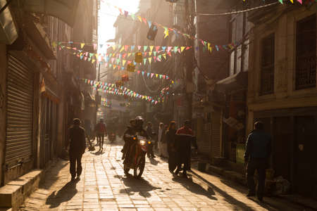 Kathmandu, Nepal - November 17, 2018: Early morning in Kathmandu. Nepali people going down the street in Thamel district.のeditorial素材