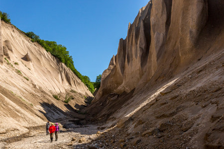 Petropavlovsk-Kamchatsky region, Russia - July 18, 2018: Group of tourists walking near Kuthin bata,...