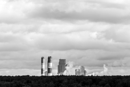 Air pollution in city environment, image of big industrial pipes