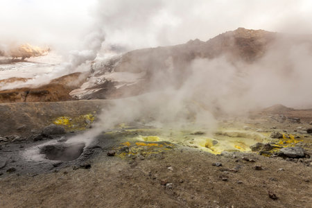 Steaming, sulfuric, active fumaroles near Volcano Mutnovsky, Kamchatka Peninsula, Russia