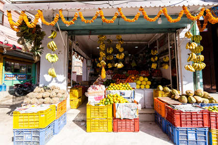 Kathmandu, Nepal - November 17, 2018: Small fruit shop in central Kathmandu street.のeditorial素材