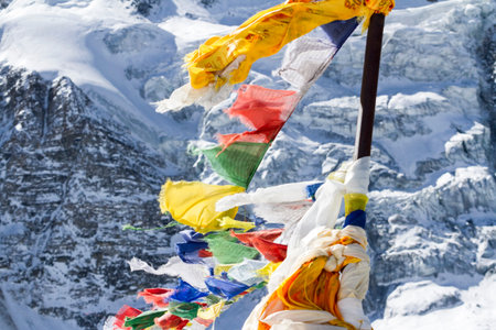 Prayer buddhist flags fluttering in the wind. Annapurna conservation area, Nepal.