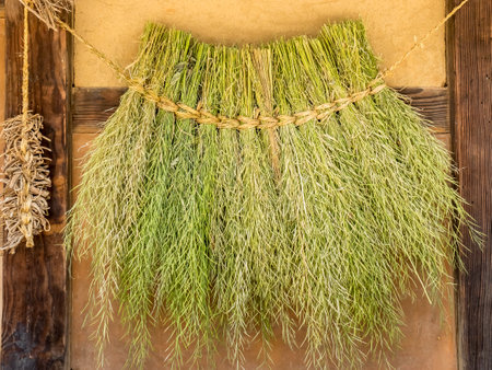 Dried herbs and spices hanging on the wooden background. Organic natural spice.の写真素材