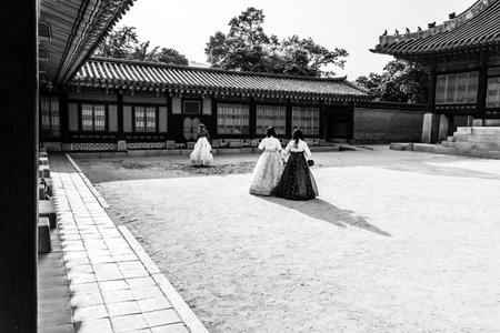 Seoul, South Korea - June 18, 2017: Young women in traditional wear - hanbok visiting the Gyeongbokgung Palace.のeditorial素材