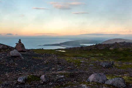 Coastline of Barents sea on the sunset. Arctic ocean, Kola Peninsula, Russiaの写真素材
