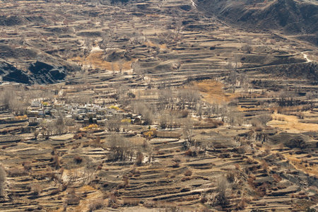 Asian mountain village and terrace fields in autumn in Lower Mustang, Nepal, Himalaya, Annapurna Conservation Areaの写真素材