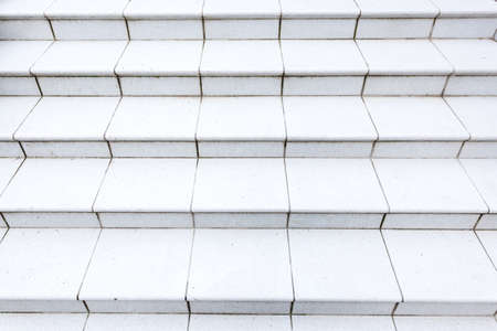 Stone granite white stairs. Textured background. Close up image.の写真素材