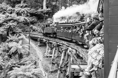 Melbourne, Australia - January 7, 2009: Puffing Billy steam train with passengers. Historical narrow railway in the Dandenong Ranges near Melbourne.のeditorial素材