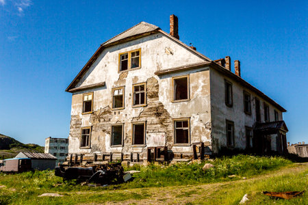 Destroyed old abandoned stone house in village Teriberka in Kolsky District of Murmansk Oblast, Russiaの写真素材
