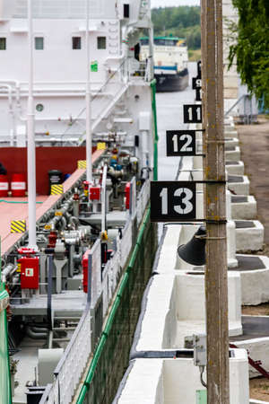 Vytegra, Russia - August 16, 2015: Cargo ships entered the White Sea-Baltic Canal Gateway. Close up imageのeditorial素材
