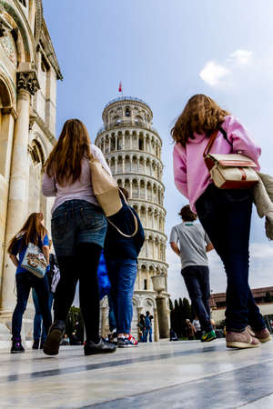 Pisa, Italy - March 17, 2012: People taking photo near the Tower of Pisa (Torre di Pisa).のeditorial素材